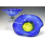 Two late 29th Century large studio glass bowls on stands, 49cm diameter and smaller Condition: