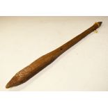 Wooden club, round handle to squared pointed top, carved with crude line decoration, 63cm Condition: