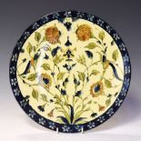 Doulton & Co Lambeth faience charger painted with an Iznik design, signed 'AC' (for Alice Caffin)