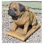 Modern composition garden ornament in the form of a Pug dog by Sanctuary Stone, 36cm high Condition: