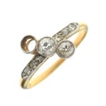 18ct gold, platinum and diamond dress ring, having two (of three) larger stones diagonally-set