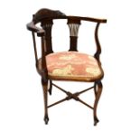 Edwardian mahogany bow arm corner chair, having pink floral upholstered seat, 75cm high Condition: