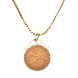 Edward VII half sovereign 1910, within textured 9ct gold frame, scroll mount and loop as pendant,