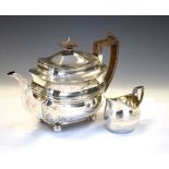 George III silver teapot standing on four ball feet, London 1807, 17cm high, together with a