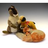 Steiff fox cub in a sleeping position, together with a Chiltern mohair dog, and a Chad Valley rabbit