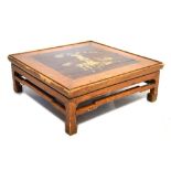 Chinese provincial low occasional table with pen work decoration, 70cm x 70cm x 26cm Condition: