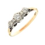 Yellow metal and three-stone diamond ring, platinum claw set, shank stamped 9ct, size O, 1.9g