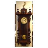 Large Vienna style wall clock, having Roman dial with brass unicorn finial to top, 15cm high