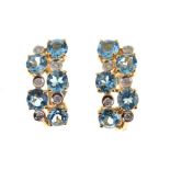 Pair of blue topaz and diamond earrings