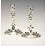 Pair of Elizabeth II silver candlesticks in the early 18th century manner