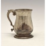 George III silver mug of baluster form with leaf mounted scroll handle