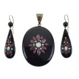 Victorian black enamel and gem set oval pendant,