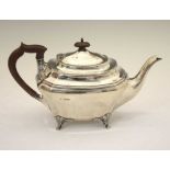George V silver teapot of shaped rectangular form standing on four cast feet