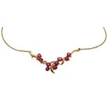 Yellow metal (750) ruby and diamond pendant