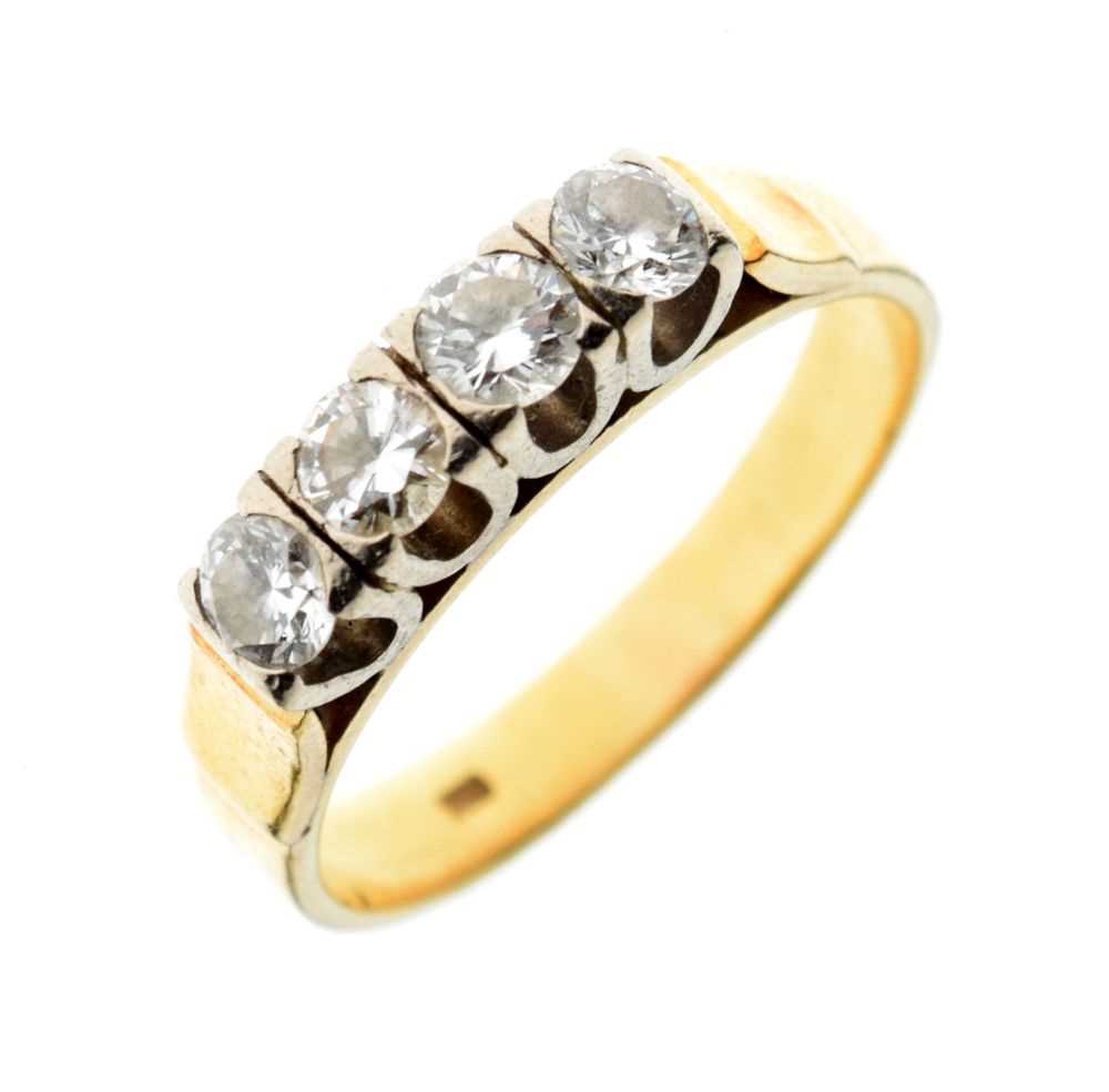 Yellow metal, four-stone ring,
