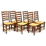 Good quality rustic dining suite comprising table and six ladderback chairs