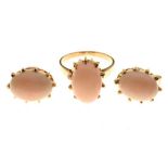 Unmarked yellow metal ring set pale pink cabochon