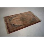 Small Persian silk rug