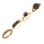 Three 9ct gold garnet set dress rings a 14ct dress ring set white and blue stones