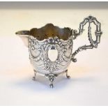 Silver cream jug with classical decoration