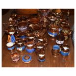 Large selection of mainly Victorian copper lustre pottery jugs etc