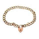 Yellow metal curb-link charm bracelet with 9ct gold padlock