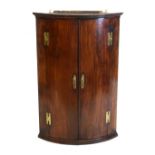 George III mahogany bowfront hanging corner cupboard