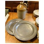 Pair of antique pewter plates, and a stoneware flagon