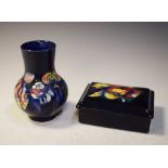 Moorcroft pottery 'Orchid' pattern bulbous vase and lidded box