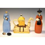 Two Roby, Paris figural decanters and a camel teapot