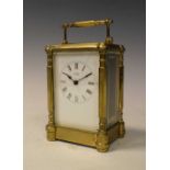 Brass carriage clock with white enamel dial