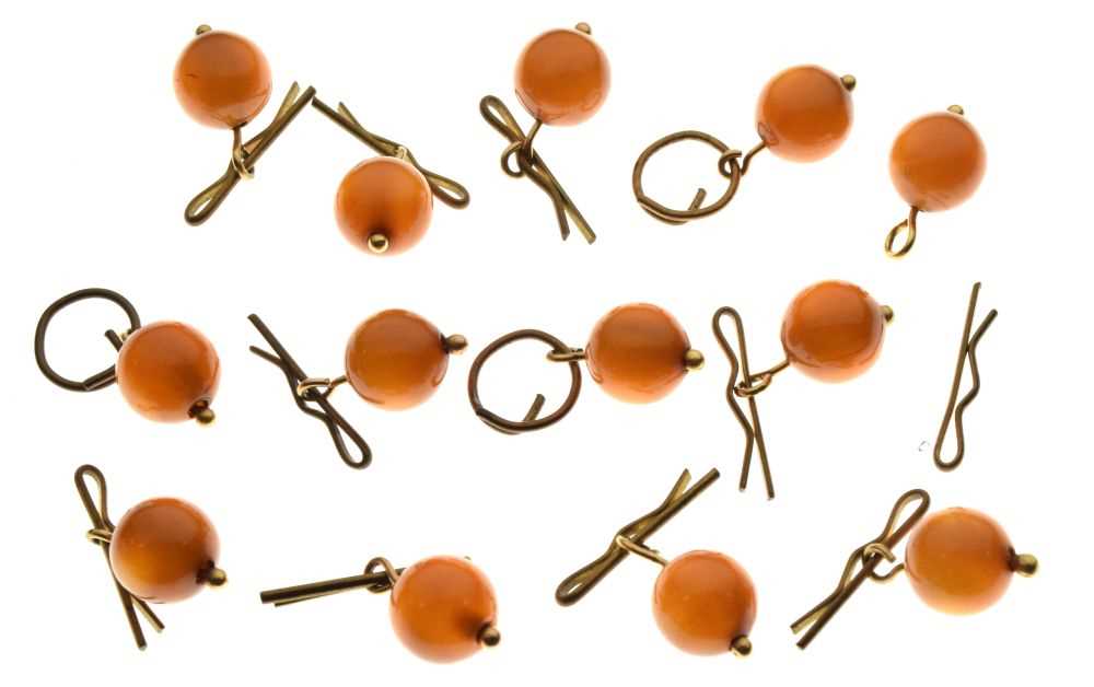 Collection of thirteen amber bead buttons,