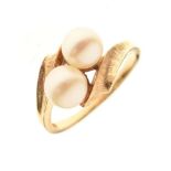 Yellow metal ring set two pearls