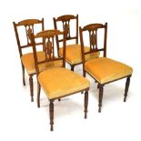 Four Edwardian chairs with gold/brown seats