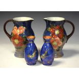 Pair of Wedgwood lustre vases and pair of Doulton jugs