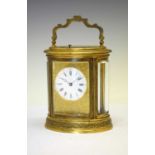 Oval engraved brass-cased repeater carriage clock