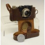 Leica camera in leather case
