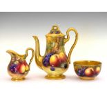 George V Royal Worcester porcelain fruit-painted coffee pot, cream jug and sugar basin