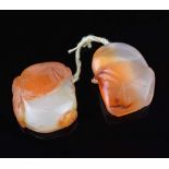 Two Chinese carved peach agate miniature fruit