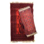Two red ground rugs