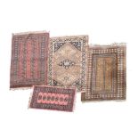 Group of four Eastern-style rugs