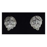 Pair of unmarked white metal leaf design diamond set stud earrings