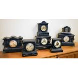 Seven ebonised mantel clocks