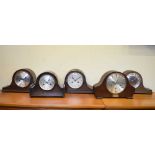 Five assorted oak-cased mantel clocks