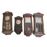 Four assorted early 20th Century oak wall clocks