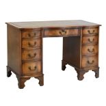 Reproduction mahogany serpentine twin pedestal desk