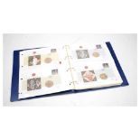 Album of Royal Mint numismatic commemorative £5 coin covers