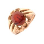 Gentleman's 9ct gold dress ring set faceted red stone, 7.2 g