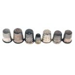 Seven various silver and white metal thimbles