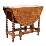 Oak gateleg table with carved frieze to top